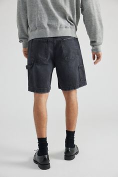 Denim carpenter shorts by UO's essential BDG label. Classic utility look with a relaxed fit and mid-rise waist. Includes front and back pockets & a hammer sling loop. Urban Outfitters exclusive. Features Denim carpenter shorts from BDG Relaxed fit with a mid-rise waist Zip fly; button closure UO exclusive Content + Care 100% Cotton Machine wash Imported Size + FIt Model in Chocolate is 6'2" and wearing size 32 Measurements taken from size 32 Rise: 13" Inseam: 8" Leg opening: 11.5" | BDG Denim Carpenter Short in Washed Black, Men's at Urban Outfitters Utility Jean Shorts With Side Pockets, Relaxed Fit Utility Jean Shorts, Utility Jean Shorts With Cargo Pockets For Streetwear, Utility Relaxed Fit Jean Shorts With Pockets, Utility Jean Shorts With Relaxed Fit, Utility Jean Shorts With Pockets And Relaxed Fit, Utility Cotton Jean Shorts For Streetwear, Urban Relaxed Fit Jean Shorts With Pockets, Relaxed Fit Streetwear Shorts With Belt Loops