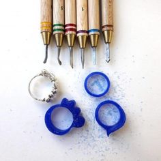 several different types of pens and cutters next to each other