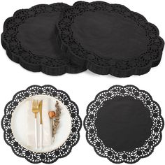 three black place mats and two white plates