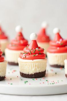 Ingredients: For the Cheesecake Bites: 1 (8 oz) package cream cheese, softened 1/2 cup whipped cream or cool whip 1/4 cup powdered sugar 1 tsp vanilla extract Graham cracker crumbs (for the base) For the Santa Hat: 12 fresh strawberries, hulled 1/4 cup whipped cream (for the top of the hats) Mini marshmallows, cut in half (for the pom-pom on the hat)