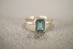 I am offering you this stunning vintage sterling silver wedding band stacker design ring.  This features a raised relief  single stone setting.  This has a bezel set rectangle shaped genuine Blue Topaz stone with gold overlay.  This ring is currently a size 7 1/2, though I am sure it could be sized up or down. Please review all of my pictures, as they are all a very important part of , my listing/descriptions. Topaz Bezel Setting Ring, Classic Silver Topaz Ring With Bezel Setting, Luxury Heirloom Topaz Ring With Bezel Setting, Elegant Bezel-set Topaz Ring, Blue Bezel-set Ring Jewelry, 2 Am, Sterling Silver Wedding Band, Vintage Wedding Band, Blue Topaz Stone