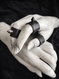 "Wide cuff ring with spike accent. ~ band made from jet black vegan faux leather ~ each piece is custom fitted, double seamed, and has a soft felt suede type backing ~ choose from black or silver spike, or a set with one of each color ~ band measures: 5/8\" wide ~ spike: 7/16\" high x 1/4\" wide ~ check the ring size guide for instructions on how to find your measurements ~ made-to-order All designs are copyright of Our Widow, and may not be copied or re-sold under a different name." Leather Cuff Diy, Finger Cuff, Spiked Jewelry, Spike Ring, Rock Rings, Shield Ring, Black Goth, Cuff Ring, Goth Jewelry