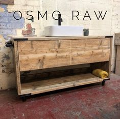 a bathroom vanity made out of wood with the words osmo raw above it