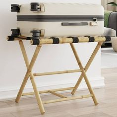 This luggage rack is the perfect helper to pack, unpack and store your suitcase. Durable material: Bamboo is known for its flexibility and hardness. Bamboo furniture is a good option when you want sturdy furniture made from natural materials. Ample storage space: The suitcase stand has two shelves. The upper shelf consists of 5 sturdy straps and is large enough to hold larger suitcases and the lower shelf is ideal for shoes or hand luggage. Foldable: The luggage holder can be easily folded up for saving space when not in use. Suitcase Stand, Pet Bowl Stands, Large Suitcase, Camping Furniture, Bamboo Furniture, Mesa Exterior, Luggage Rack, Hand Luggage, Low Shelves