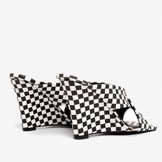 Description:Embrace the black and white aesthetic with the help of these wedge heels' archival prints. Presented in black and white combination. this work of art adorns two versions of the super trendy style: retro stripe print and stylish checkerboard print. Made from high quality patent leather with slick texture. this pair has commanding square toes before ending with wedge-style tapered heels. Bound to lend you style and elegance. they are accented by a criss-cross effect with wide upper ban Wedge Mules, Wedges Style, Simply Chic, Long Drop Earrings, New Chic, Retro Stripes, Black And White Aesthetic, Trendy Style, Silver Drop Earrings