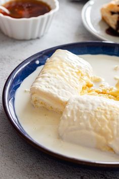 some food is sitting on a blue and white plate