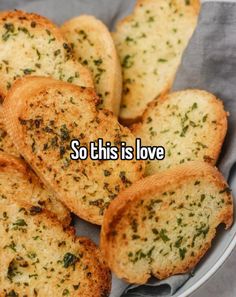 some bread that is sitting on top of a plate with the words so this is love