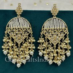 BEAUTIFUL KUNDAN JHUMKI EARRING *  Main Color : Gold * Skin Friendly : This Product does not contain harmful constituents. Anti-allergic safe for Skin. * Quality : Made from Premium Quality Material. This Product assures to remain in its Original Glory even after several usages.     . Actual Images of item are shown above, Please be aware of the actual colors may vary from the color shown on your screen, as monitor    settings may vary from individual to individual. . Welcome to Our Etsy Store! Festive Beaded Chandbali Chandelier Earrings, Festive Chandelier Earrings With Dangling Beads For Party, Celebration Beaded Chandbali Earrings, Festive Beaded Dangle Pearl Earrings, Festive Beaded Dangle Earrings, Beaded Chandbali Earrings For Celebration, Celebration Chandbali Beaded Earrings, Traditional Pearl Earrings With Dangling Beads For Party, Festival Beaded Dangle Bridal Earrings