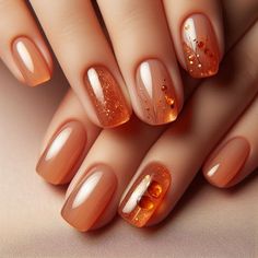 Nails painted in a translucent amber hue with a glossy finish. Each nail is adorned with tiny gold flecks and shimmer, mimicking the warm glow of amber stones. This minimalist yet elegant design captures the essence of autumn warmth. Amber Nails Design, Nail Amber, Fall Jelly Nails, Nail Design For Fall, Amber Nails, Stone Nails, Fall Nail Art Ideas, Nails Painted, Kutek Disney