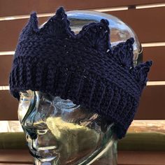 a knitted hat on top of a mannequin head