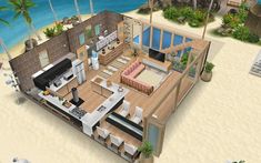 an aerial view of a beach house with the living room and kitchen area open to the ocean