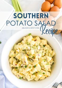 a white bowl filled with potato salad next to eggs