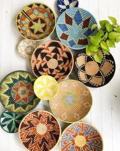 many colorful bowls are arranged on the floor