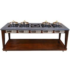 a table with three burners on it