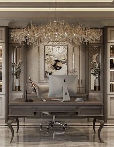 an elegant home office with chandelier hanging from the ceiling