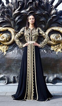 Black Arabic Gown with Embroidery embellished with dabka, zari, stones. Buy Arabic dresses online in USA. Black Arabic gown for Party Latest Collection. Elegant Black Gown With Dabka Work, Black Embroidered Long Sleeve Gown, Black Long Sleeve Embroidered Gown, Traditional Black Gown With Dabka Work, Black Bollywood Long Sleeve Gown, Black Long Sleeve Bollywood Gown, Black Bollywood Gown With Long Sleeves, Black Long Gown For Festive Occasions, Traditional Black Gown With Zari Work