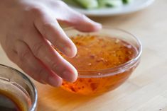 a person reaching for something in a bowl