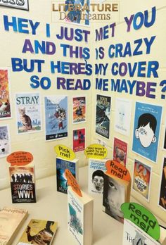 there are many books on display in the library and one has a sign that says, hey i just met you and this is crazy but here's my cover so read me maybe?