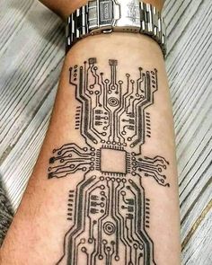 a person's arm with a tattoo on it that has an electronic circuit board design