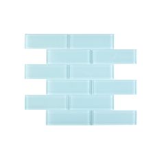 the back side of a glass tile wall with white and light blue tiles on it