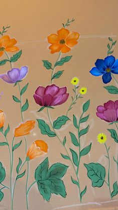 colorful flowers painted on the side of a wall