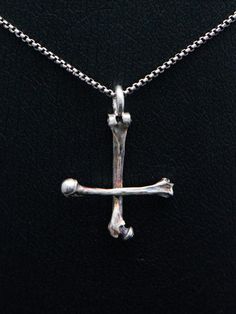 Silver bone cross necklace, sterling silver round venice chain included.This handmade dark art gothic cross is made from 925 sterling silver with oxidated details.Each piece is made to meet customers desires, so let me know if you want something special included your very own version.Golden version is possible also!Pendants first class finish has a lifetime guarantee and it will be renewed when needed with a cost of postage. Jewelry will be sent with FedEx International Economy, shipment is incl Petrine Cross, Gothic Silver Metal Cross Necklace, Gothic Oxidized Cross Pendant Jewelry, Gothic Metal Cross Necklace, Gothic Sterling Silver Cross Necklace, Oxidized Cross Pendant Necklace, Black Metal Necklace, Upside Down Cross, Gothic Silver Crucifix Necklace