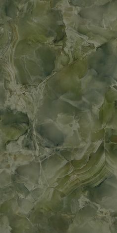 an abstract painting with green and brown colors on the surface is shown in this image