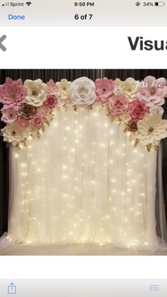 an image of a window with flowers on it and lights in the backround