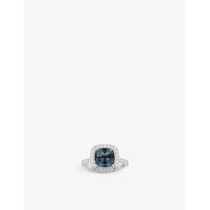 a blue and white diamond ring on a white background