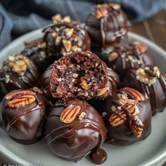 chocolate candies with pecans and nuts on a plate