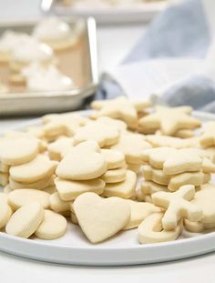 there are many heart shaped cookies on the plate