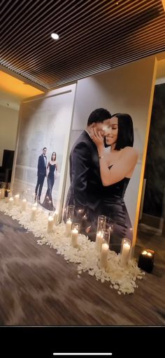 an instagram with candles and photos on the wall in front of them is being used as a photo booth