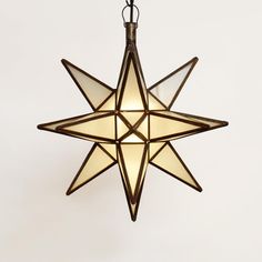 a star shaped light hanging from the ceiling