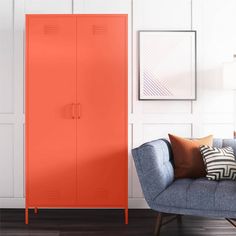 an orange cabinet in the corner of a living room