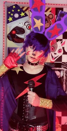 a woman with purple hair holding a microphone