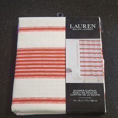 two red and white striped towels sitting on top of a counter next to each other