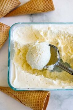 two scoops of ice cream in a glass container