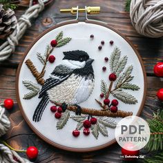 a black and white bird sitting on top of a tree branch next to some red berries