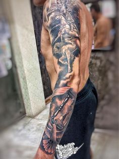 a man with a tattoo on his arm