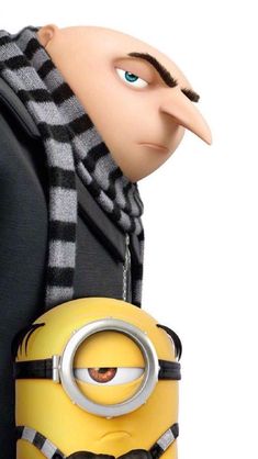 a minion with a scarf around his neck holding a cell phone in front of him