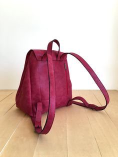 "This bag is made of high quality vegan leather in red. It is very soft and lightweight but durable. It has a rustic, distressed look. It has one interior and one exterior zipper pocket. Straps are adjustable. It is suitable for both men and women. There is two size option: Small : 17 x 27 x 30 cm Large : 20 x 30 x 36 cm IMPORTANT! Your orders between 7-25 August will be shipped on August 28. Delivery takes 2-5 days to the US, Canada, Australia and Europe; in 3-7 days to rest of the world after Red Leather Backpack With Adjustable Strap For On-the-go, Red Leather Backpack With Zipper For Everyday, Burgundy Backpack With Adjustable Strap For Daily Use, Everyday Red Leather Backpack With Adjustable Strap, Red Leather Backpack With Adjustable Strap For Everyday, Red Softback Backpack For Everyday Use, Red Softback Bags For Everyday Use, Burgundy Leather Backpack With Adjustable Strap For Everyday, Burgundy Leather Backpack With Adjustable Strap