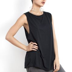 Effortless black top for women made from certified organic cotton. To see our entire collection of sustainable, low impact, slow fashion visit our shop https://www.etsy.com/shop/eleven44 It is a loose fitting, sleeveless tshirt with high quality stitching, extra binding around the neckline and armholes so it will keep its shape over time. Available in 3 easy fit sizes. The length from the shoulder to the hem is: Small - 74 cm.  Medium - 76 cm. Large - 78 cm. The width is: Small - 48 cm. Medium - 51 cm Large - 54 cm. Versatile Black T-shirt For Summer, Effortless Black Cotton Top, Effortless Black Relaxed Fit Tops, Black Relaxed Fit Muscle Tee For Everyday, Black Summer Tops For Everyday, Black Everyday Summer Tops, Casual Black Tank Top With Dropped Armholes, Casual Black Organic Cotton Tops, Black Relaxed Fit Tank Muscle Tee