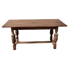 an old wooden table with two legs and a wood top, on a white background