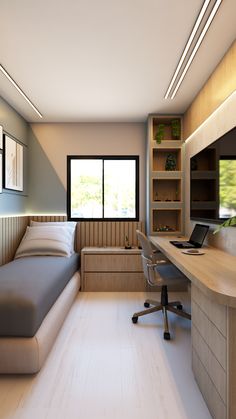 a bedroom with a bed, desk and computer monitor