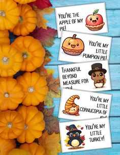 thanksgiving printables with pumpkins and other decorations on a blue wooden surface,