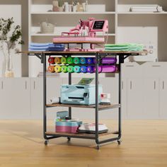 a table that has some crafting supplies on top of it in the middle of a room