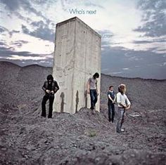 the who's next album cover with three men standing in front of an outhouse