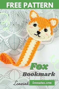 an orange and white crocheted fox brooch with text overlay that reads free pattern