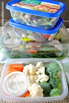 three plastic containers filled with different types of food