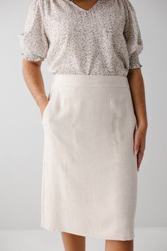 Looking for a chic and breathable essential for warmer days? Our 'Emily' Linen Blend Skirt offers a comfortable and lightweight fit and features an elastic waist and pockets. Pair with a floral blouse for a garden party or a solid tee for a weekend brunch! Exclusively designed with you in mind. 70% Viscose 30% Linen Hand Wash Cold Do Not Bleach Hang to Dry Low Iron if Needed Do Not Dry Clean Fully Lined Model Height 5'6" | Wearing Size Small Wearing 'Rosemary' Smocked Yoke Textured Top in Ivory Spring Relaxed Skirt With Pockets, Relaxed Fit Midi Skirt For Daywear, Midi Skirt With Pockets For Daywear, Effortless Spring Bottoms With Pockets, Long Skirt With Pockets For Daywear, Chic Spring Pencil Skirt With Elastic Waistband, Relaxed Spring Skirt With Slip Pockets, Relaxed Fit Midi Skirt With Pockets, Modest Relaxed Fit Bottoms For Spring